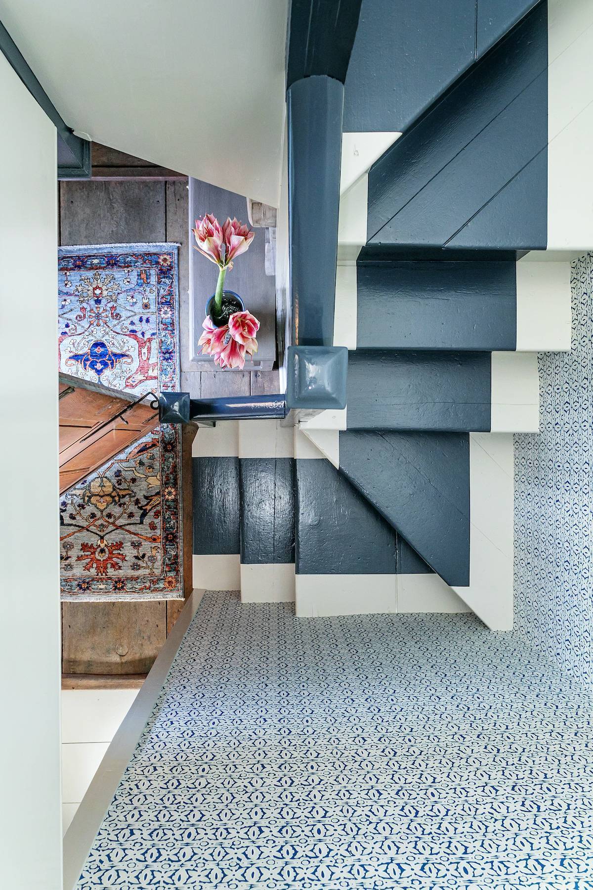 Area rugs at the bottom of a staircase