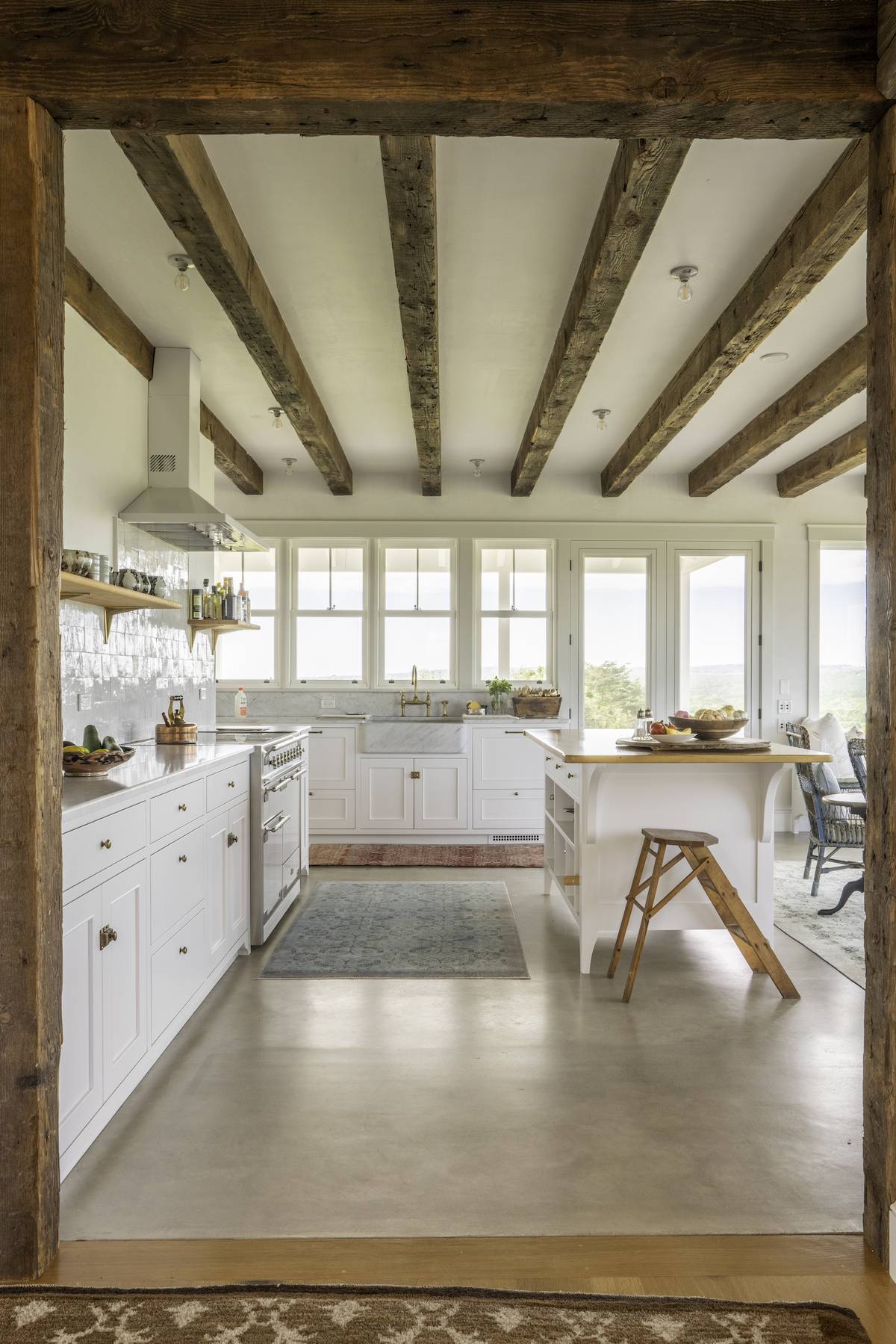 A kitchen with wooden beams
