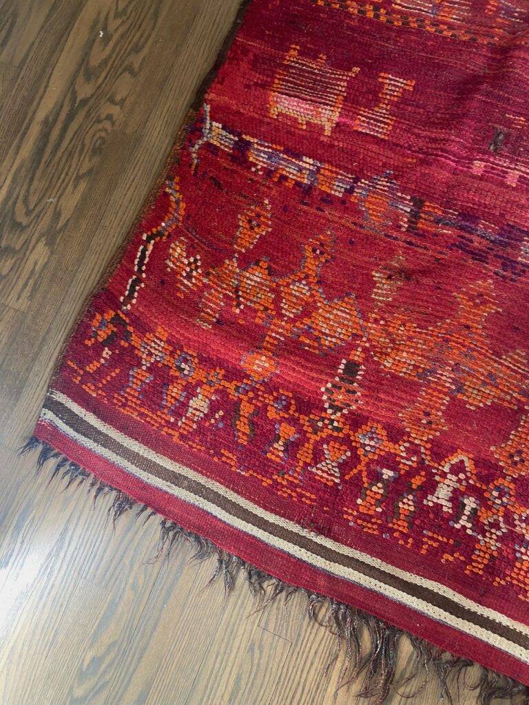 Detail of a red area rug