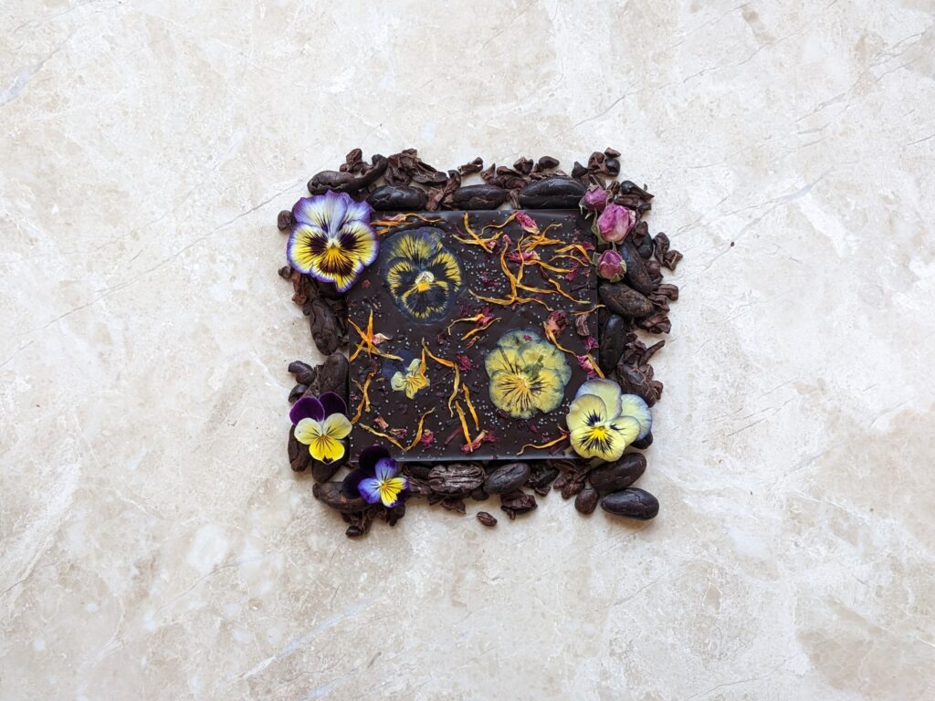 chocolate square with edible flowers